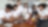 A imagem mostra os alunos ao redor de uma mesa, envolvidos no que parece ser uma oficina de eletrônica. Na mesa estão espalhados vários componentes, como fios, placas de circuito e ferramentas. Uma aluna está segurando um tablet, enquanto outro está trabalhando na montagem ou reparo de um dispositivo eletrônico com um ferro de solda. Um quadro branco com algumas anotações nele é visível ao fundo, mas o texto não é legível.